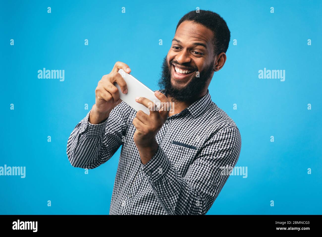 Excited bearded man using hi-res stock photography and images - Alamy