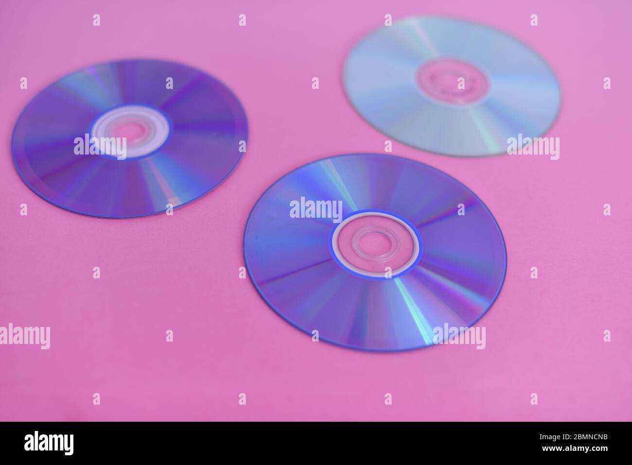 Compact disc isolated against colorful background Stock Photo Alamy