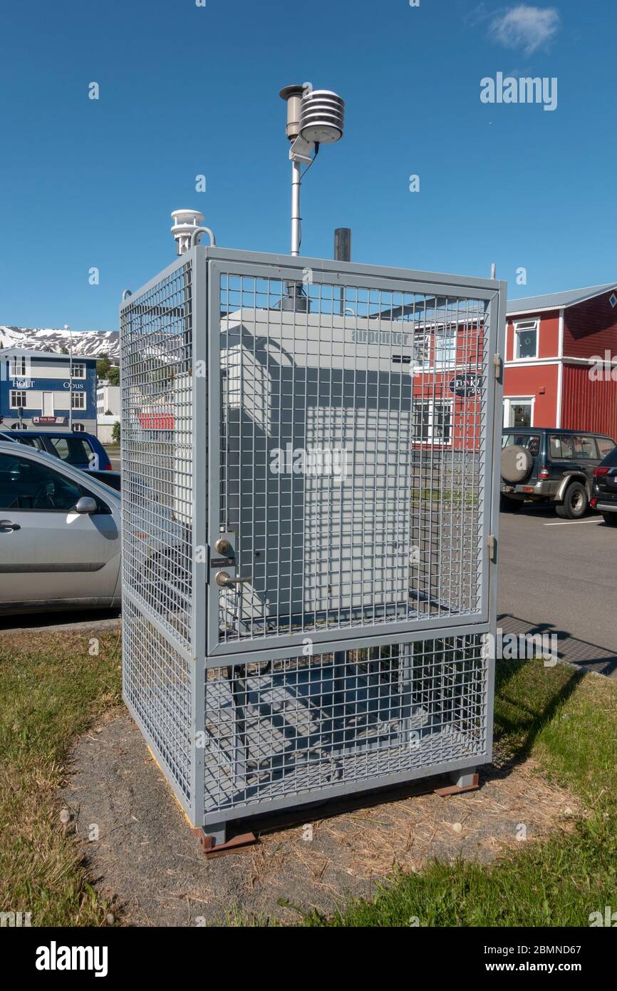 Caged Airpointer air quality monitoring (with a Met One Instruments ambient temp/baro sensor on top), Eyjafjörður Fjord, Akureyri, Iceland. Stock Photo