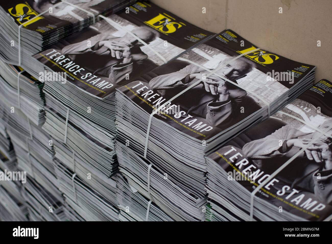 Large piles of ES (Evening Standard) magazines in central London, featuring Terence Stamp on front cover. Stock Photo