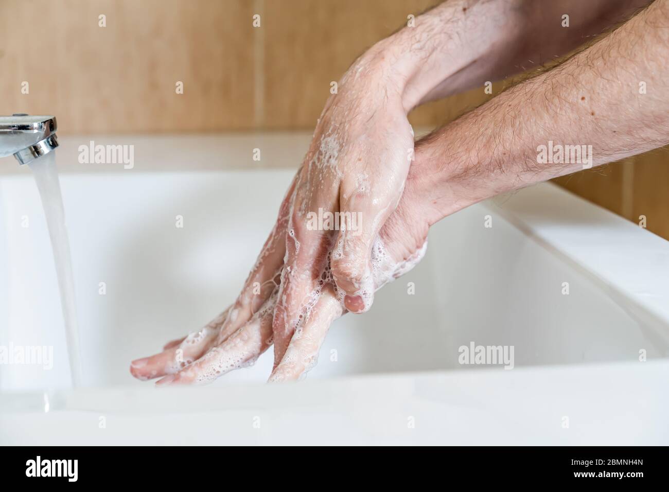 Man Clean Hand Doctor scrubbing hands arms hi-res stock photography and images - Alamy