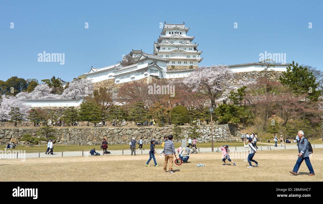 Himeji / Japan - March 31, 2018: People enjoying in Himeji castle park during the sakura cherry blossom season in Himeji, Japan Stock Photo