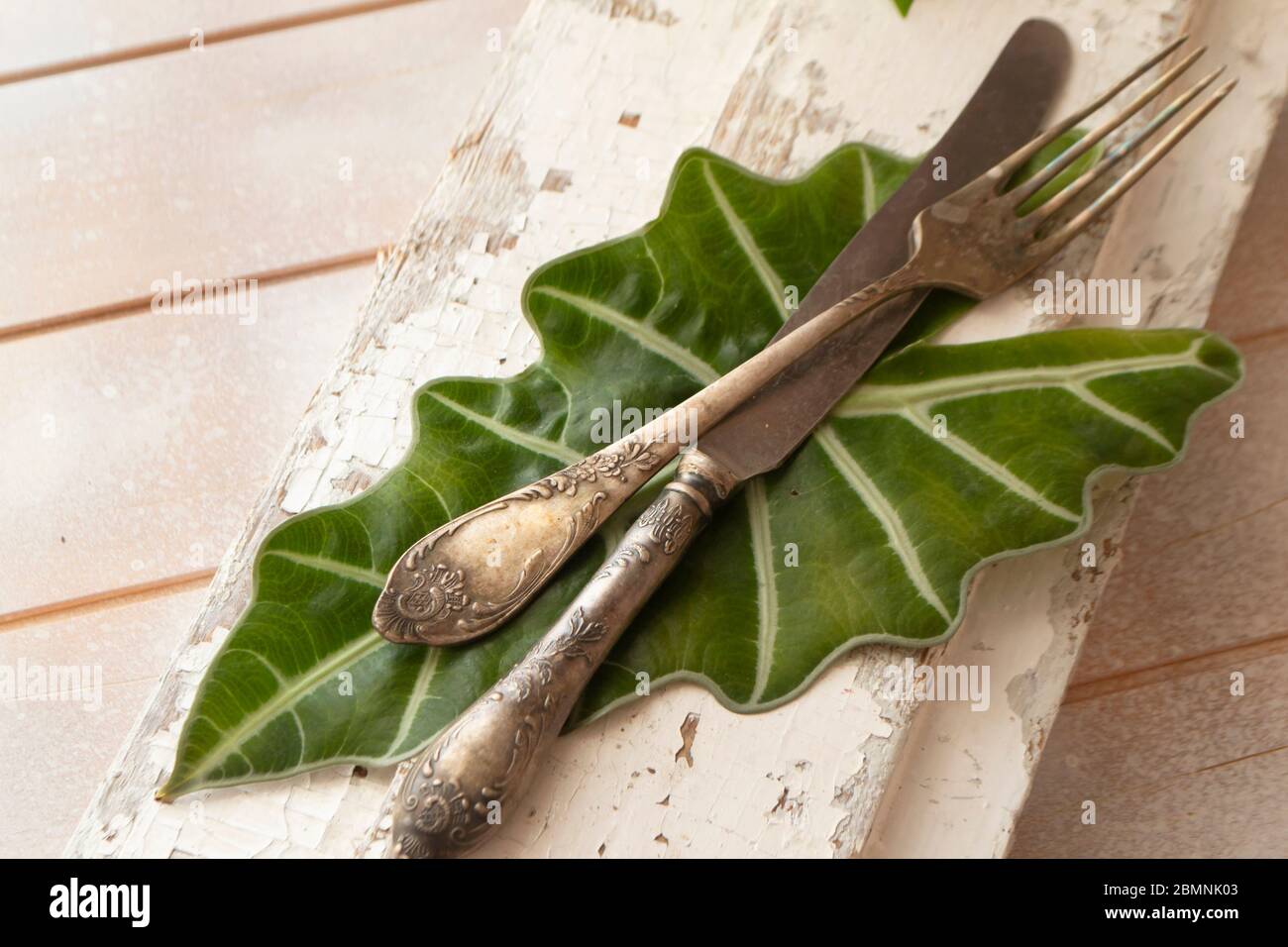 old fork with knife over the white shabby table Stock Photo