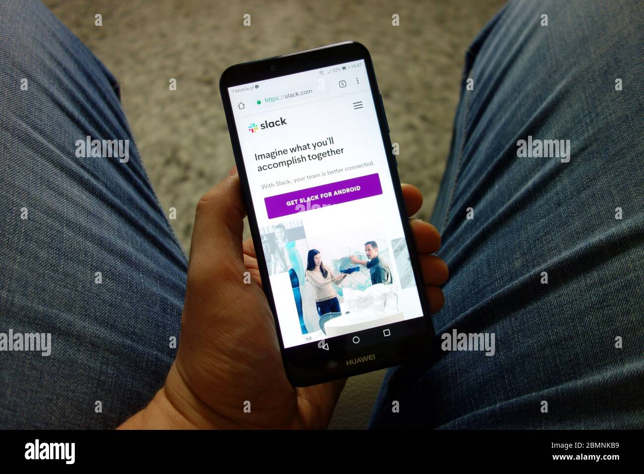 Man Holding Huawei Smartphone With Slack Website Displayed Digital Man holding huawei smartphone with slack website displayed digital