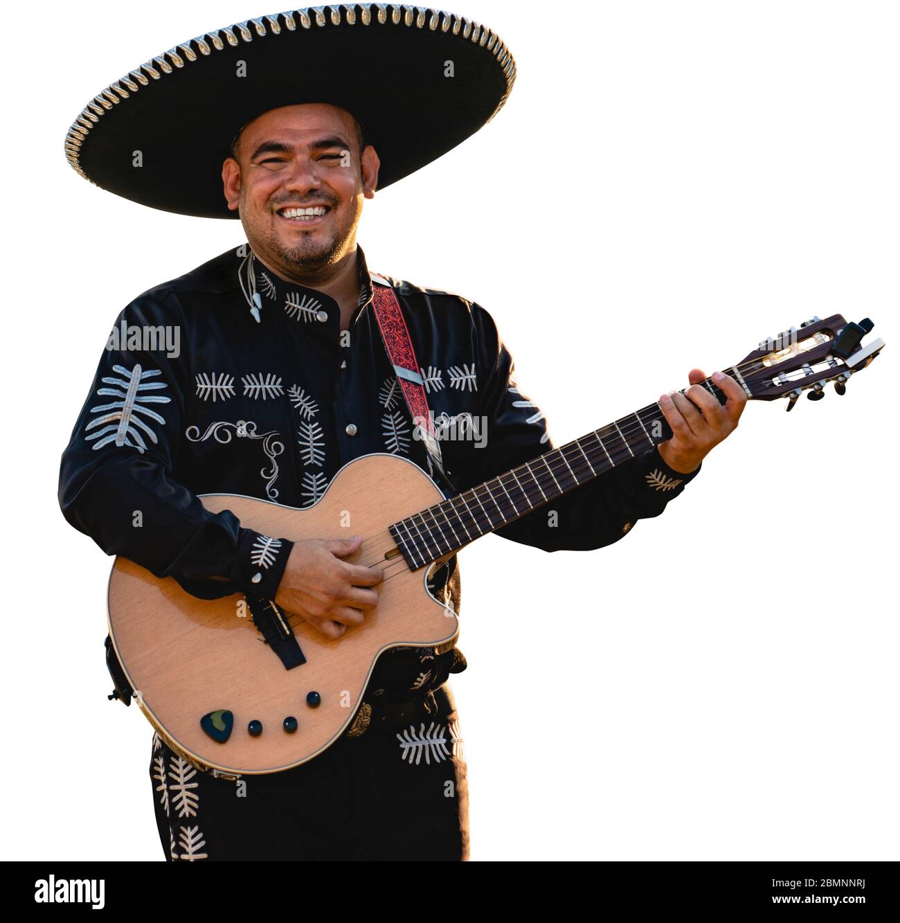 Mexican musician mariachi with a guitar isolated on white background Stock Photo