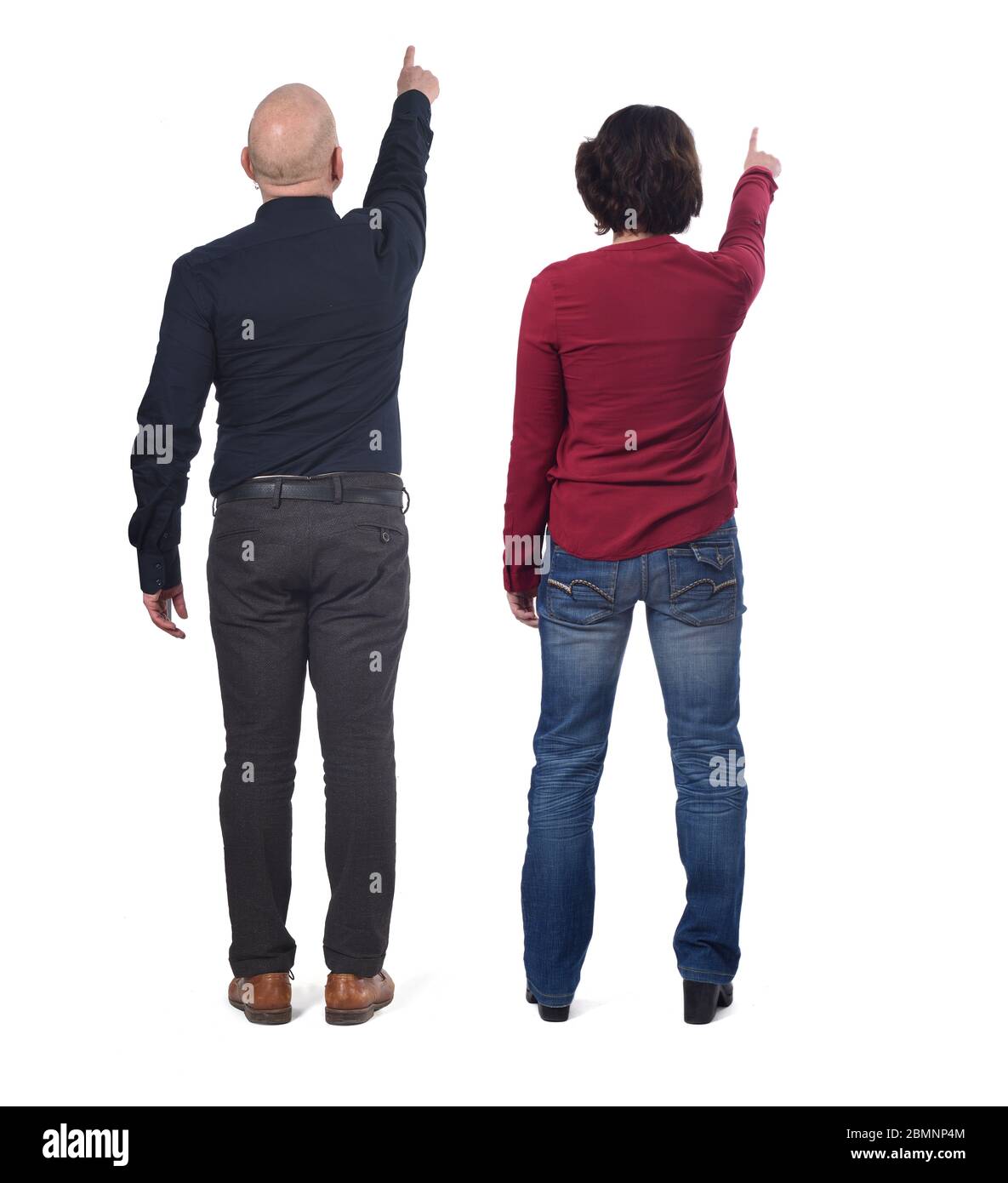 couple pointing on white background Stock Photo - Alamy