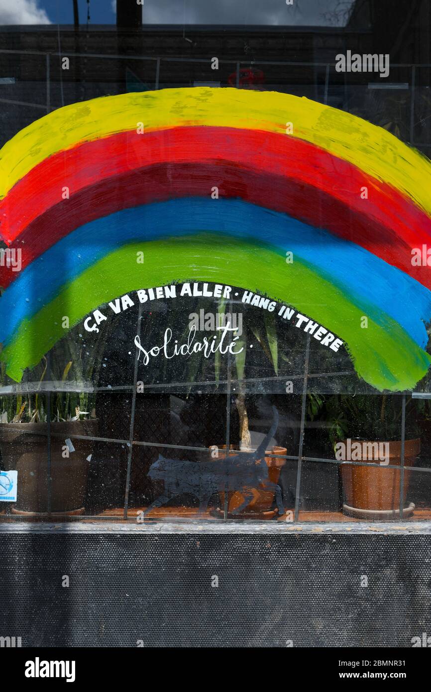 Closed restaurant bar with a rainbow of hope drawn on its window. Covid 19 Pandemic, Montreal, Canada Stock Photo