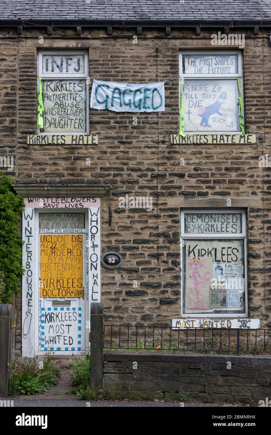 Meltham, UK - May 5 2020: A house in Meltham covered with writing and signs protesting against Kirklees Council, including references to Whorlton Hall Stock Photo