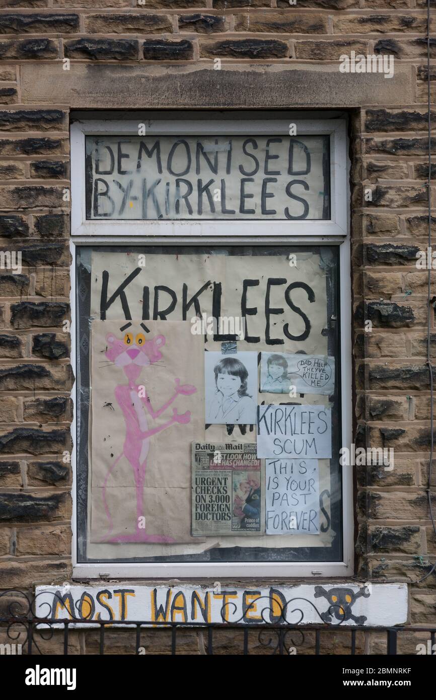 Meltham, UK - May 5 2020: A house in Meltham covered with writing and signs protesting against Kirklees Council. Stock Photo