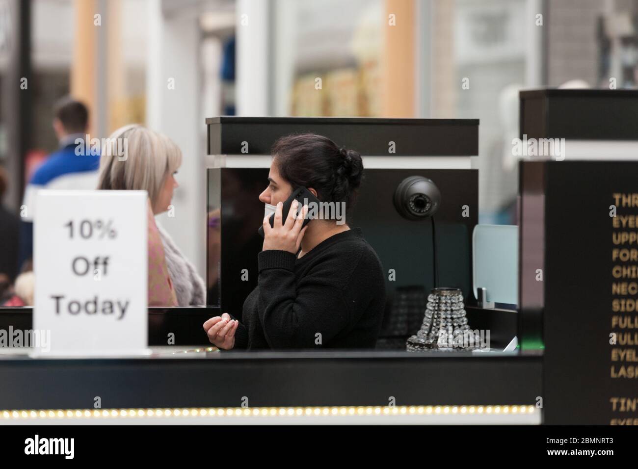 HUDDERSFIERLD, WEST YORKSHIRE, UK MARCH 21 A nail bar worker wearing