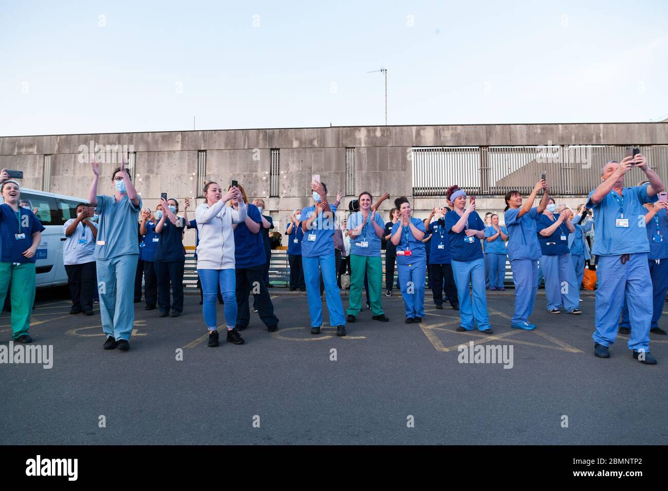 NHS staff applaud as part of Clap for our Carers outside Huddersfield Royal Infirmary. Stock Photo