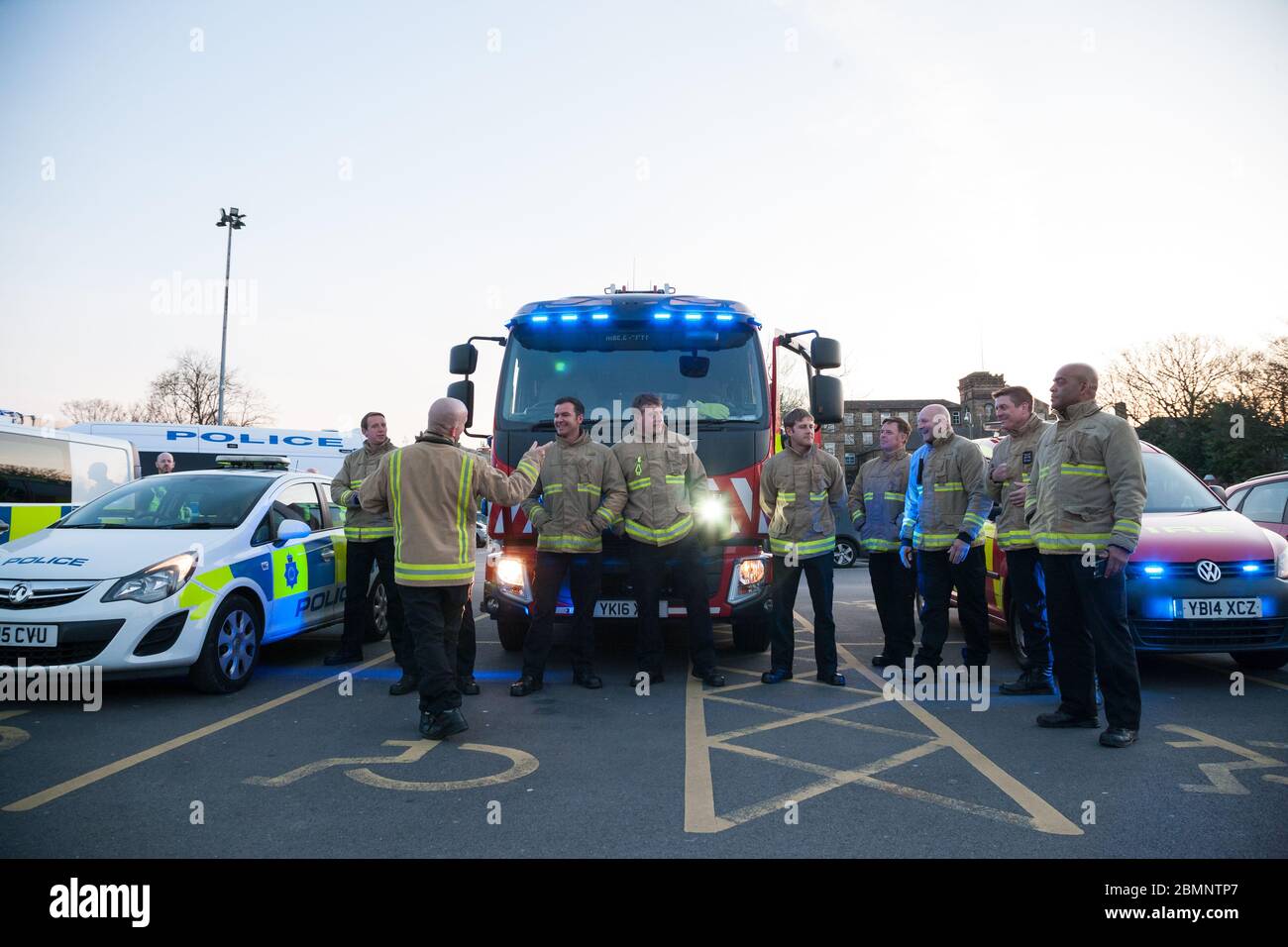 Members of West Yorkshire Fire and Rescue Service outside Huddersfield Royal Infirmary for ‘clap for our carers’. Stock Photo