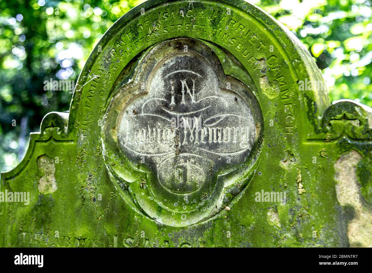 Close-up of ornate headstone saying 'In Loving Memory' at Tower Hamlets Cemetery Park, London, UK Stock Photo
