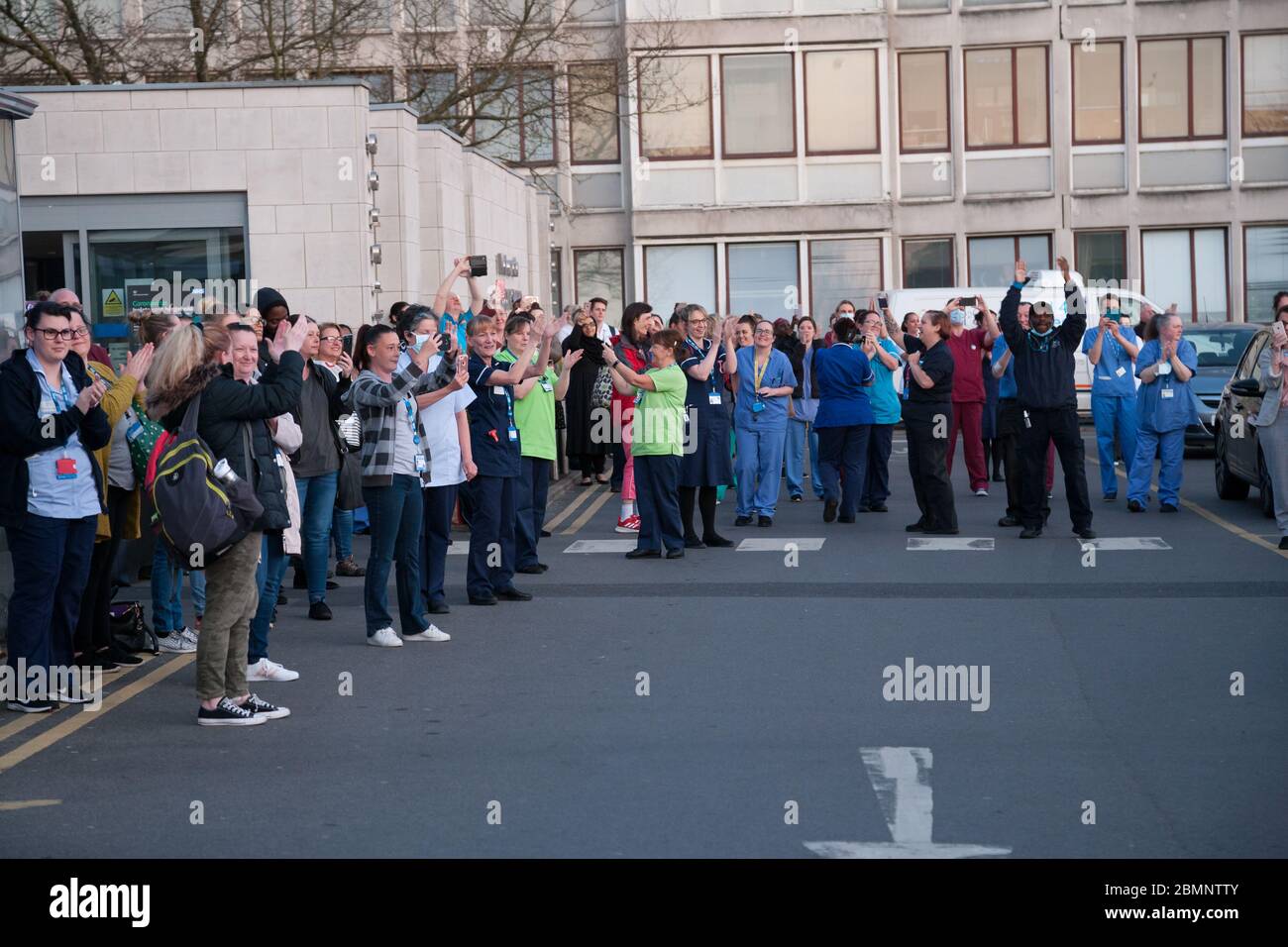 NHS workers gather in front of Huddersfield Royal Infirmary for ‘clap for our carers’. Stock Photo