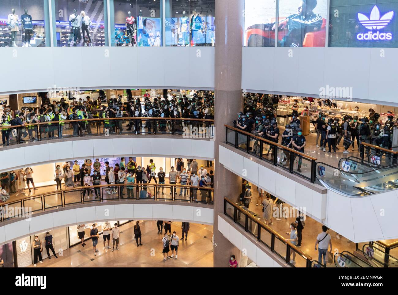 Hong Kong, China. 10th May, 2020. Police and citizens wearing face mask as  a precautionary measure against the COVID-19 coronavirus seen inside Harbour  City shopping mall in the Tsim Sha Shui district