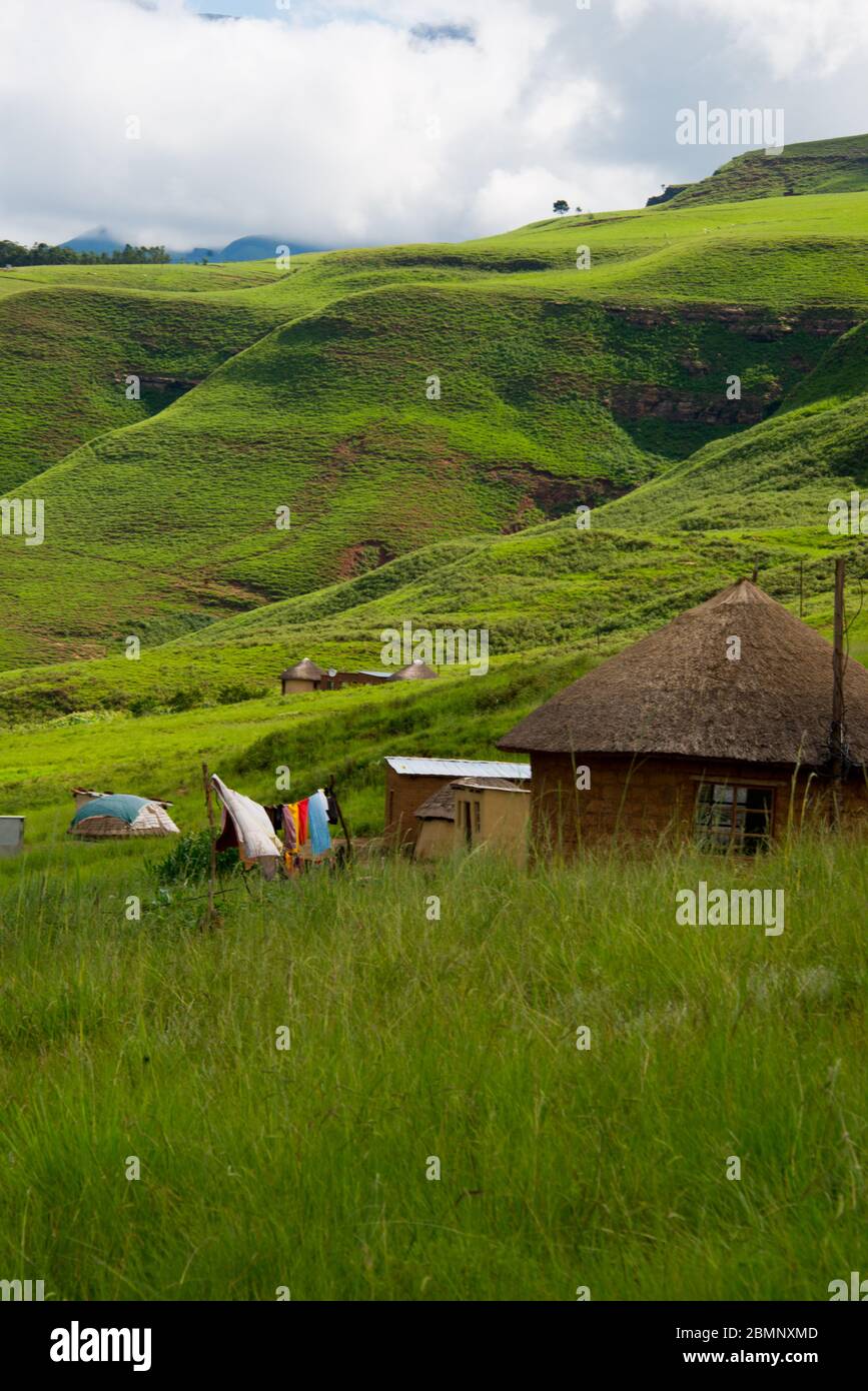 rural homestead with colorful clothesline in drakensberg mountains, kwazulu natal, south africa Stock Photo