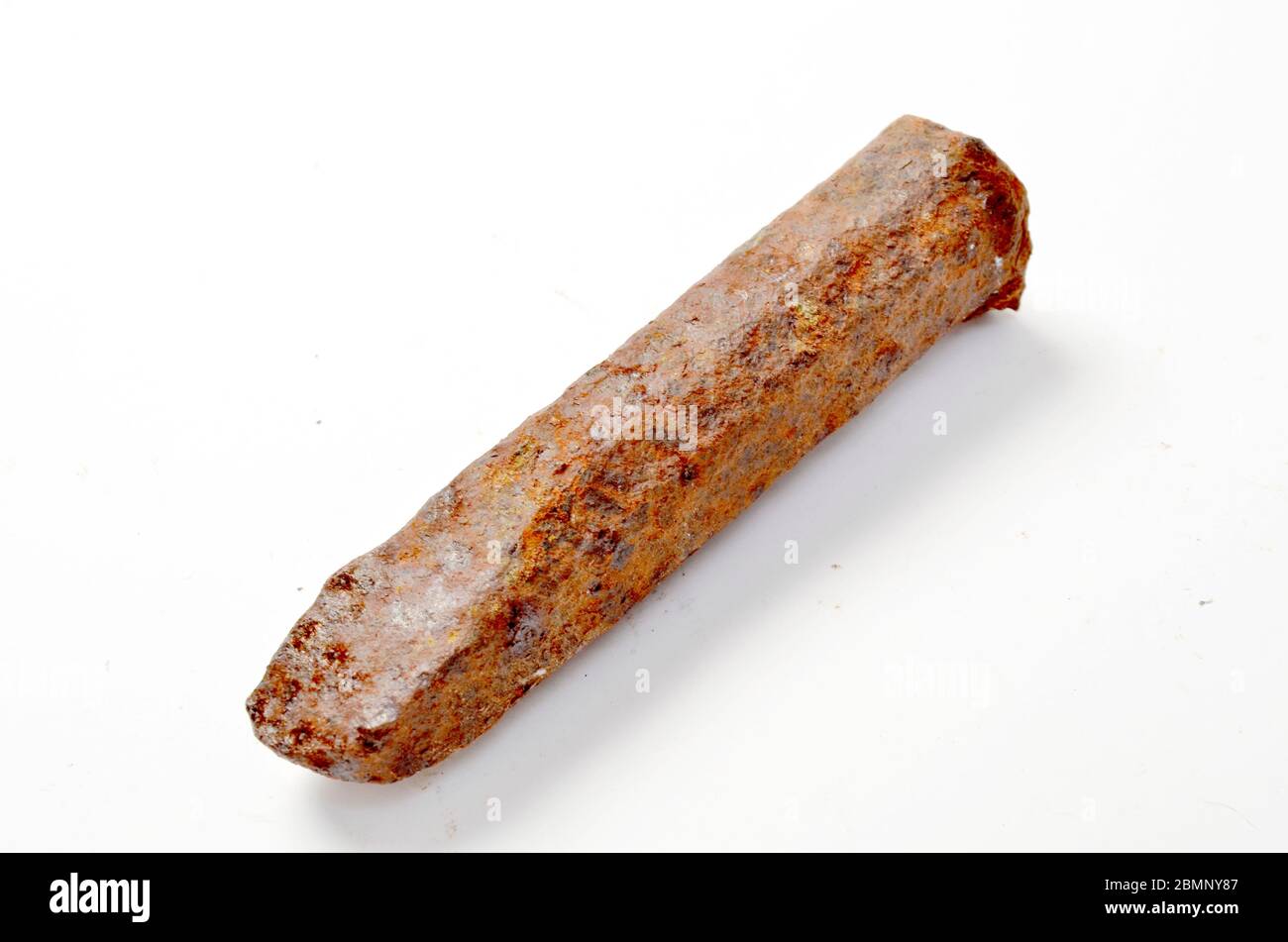 Rusty, blunt, very old cold chisel found in an old unused quarry Stock Photo
