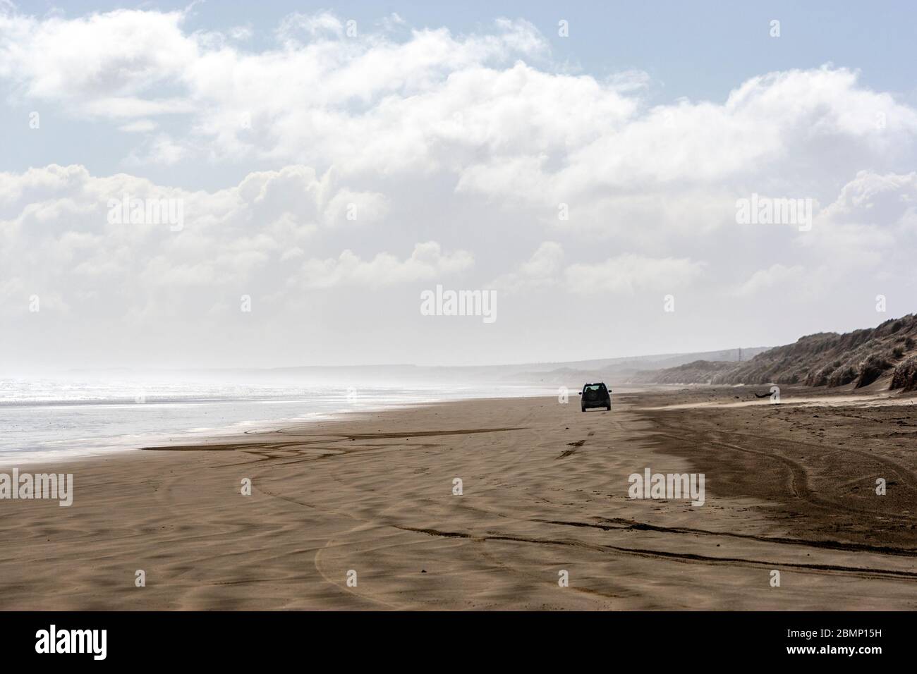 Car starting the Ninety Mile Beach, New Zealand Stock Photo