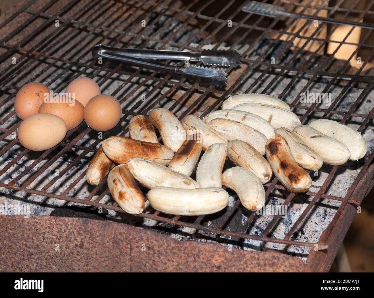 Bananas and eggs on a grill Stock Photo Alamy