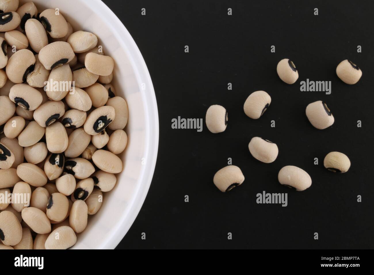 Black-eyed Beans Black background. Have a good aroma, creamy texture and distinctive flavor. Stock Photo