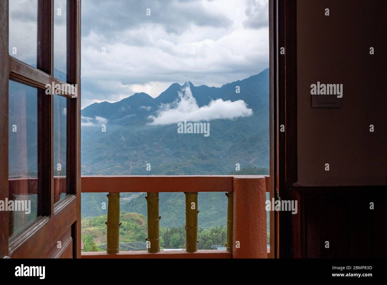 Sa Pa valley and mountain range from an hotel room doorway, Sa Pa, Vietnam Stock Photo