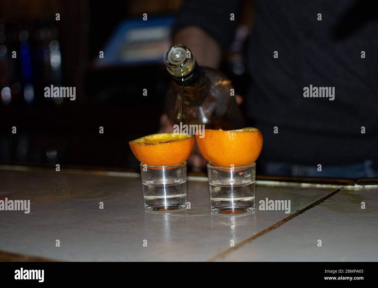 Shot at a bar, end of quarantine, disinfectant, alcohol, drink, party in the city Stock Photo