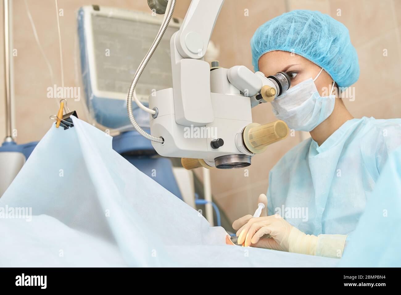 Ophthalmology laser microscope operation. Doctor in clinic. Patient treatment Stock Photo