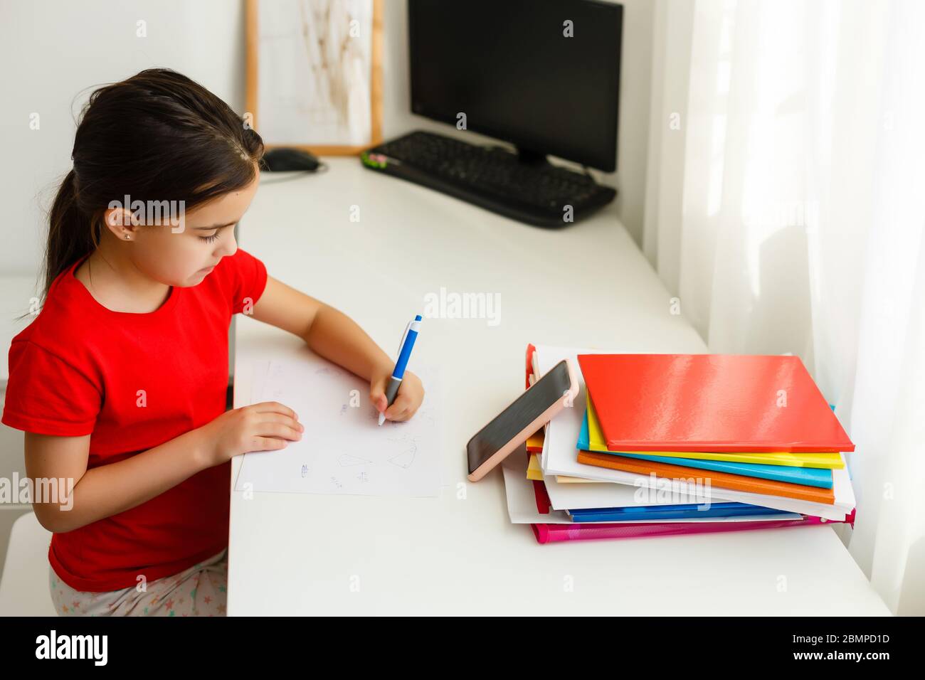Distance learning online education, little girl writes formulas Stock ...