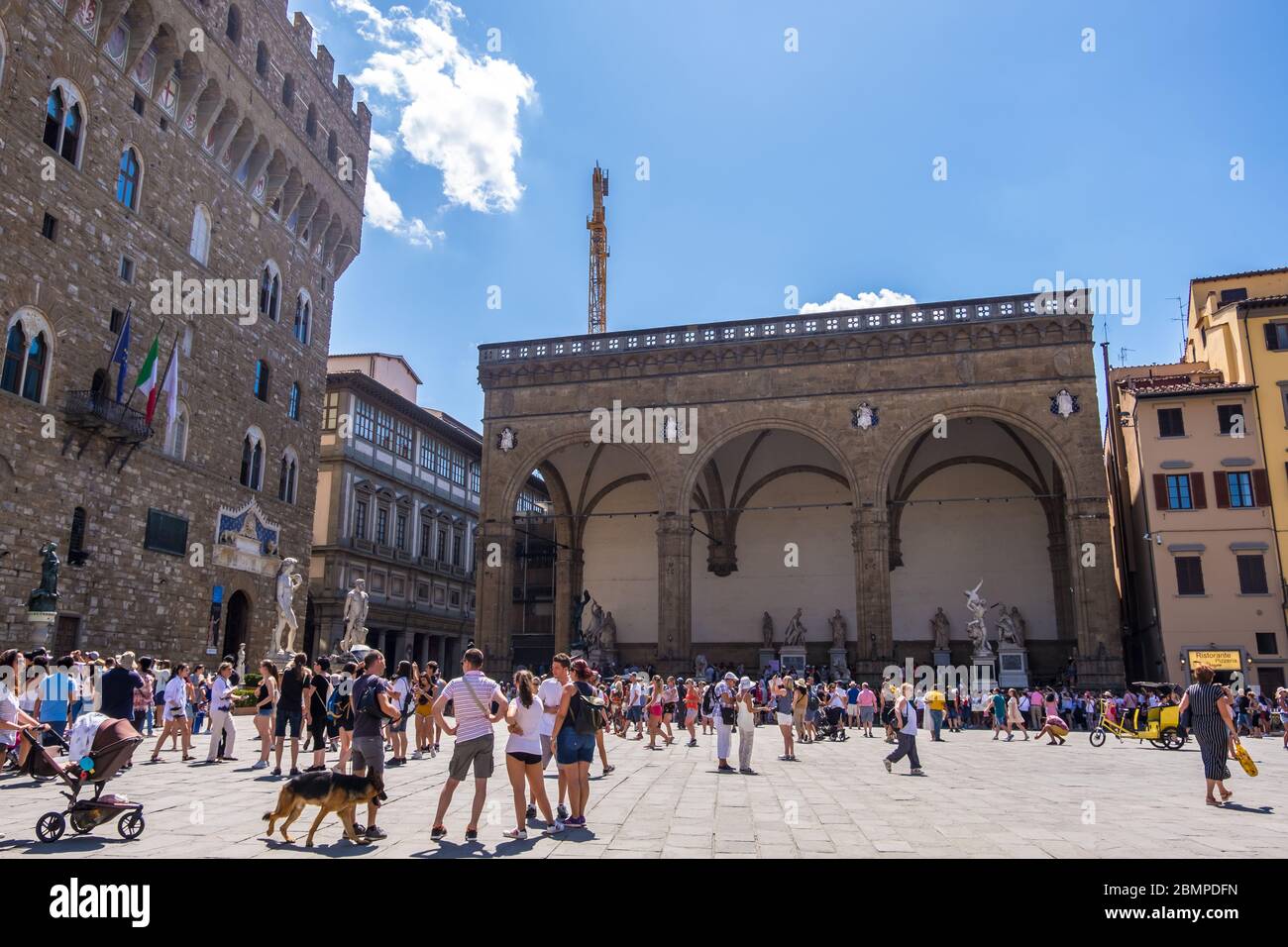Florence, Italy - August 16, 2019: Piazza della Signoria with Palazzo Vecchio in Florence, Tuscany, Italy Stock Photo
