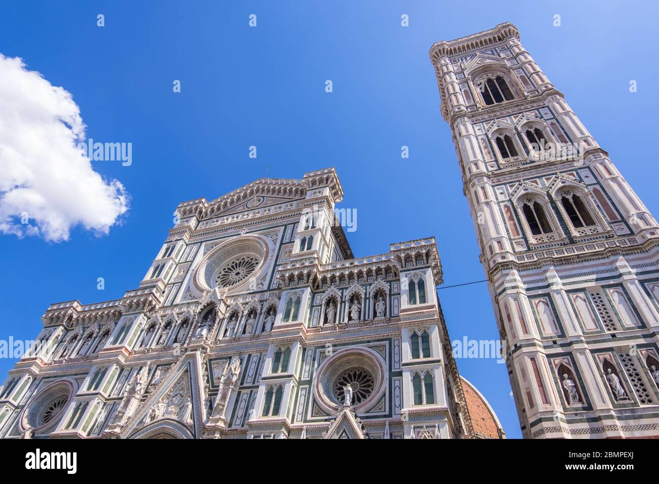 Florence, Italy - August 16, 2019: Cathedral Santa Maria Del Fiore and Giotto's Campanile on Piazza del Duomo in Florence Stock Photo