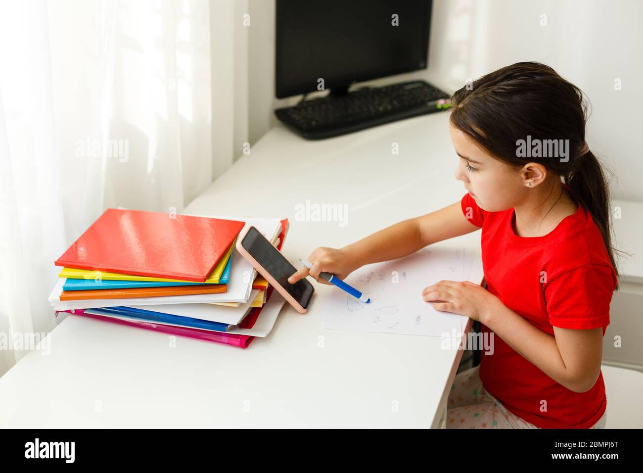 Distance learning online education, little girl writes formulas Stock ...
