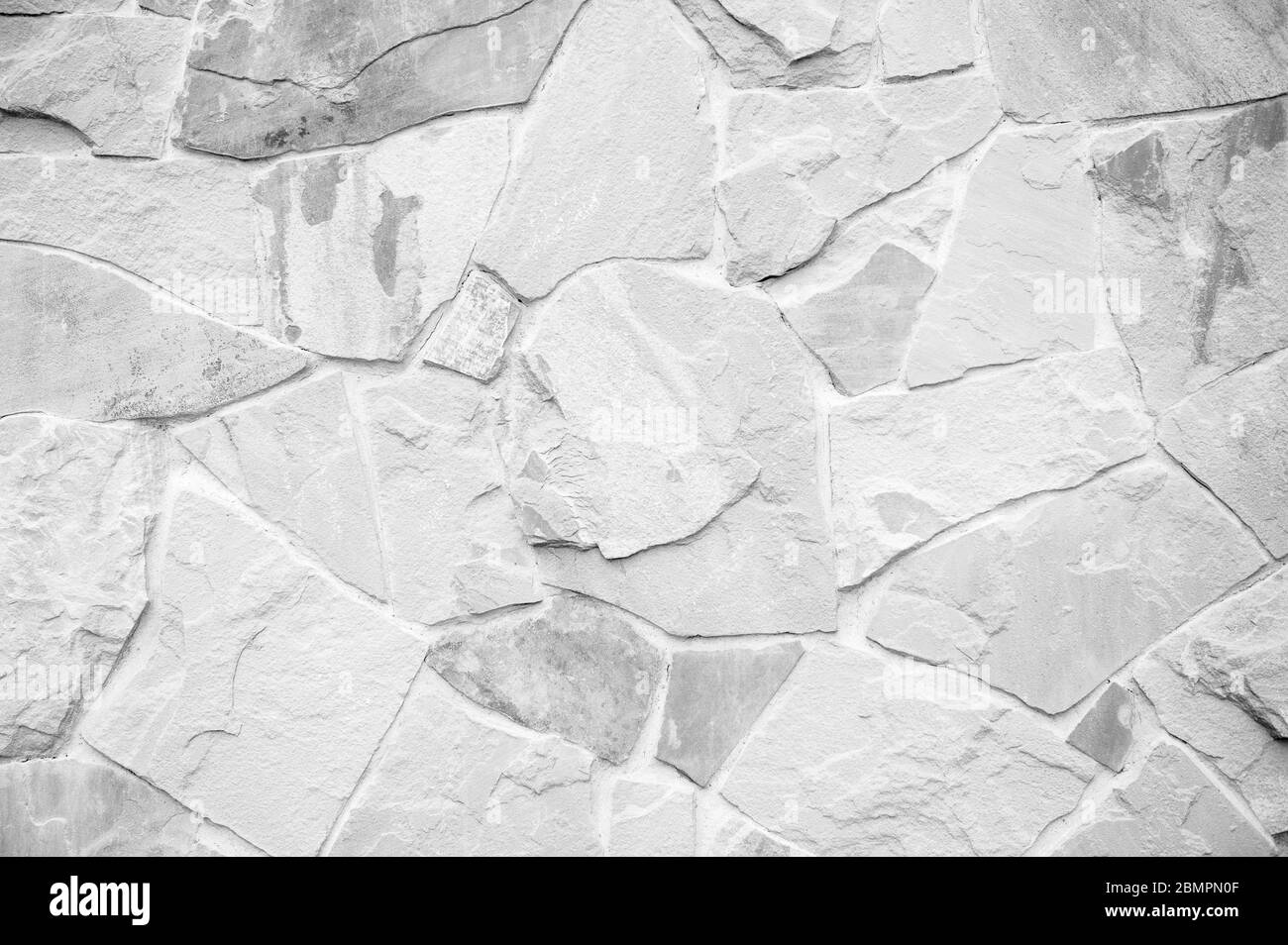 Surface white wall of stone. White stone wall background Stock Photo