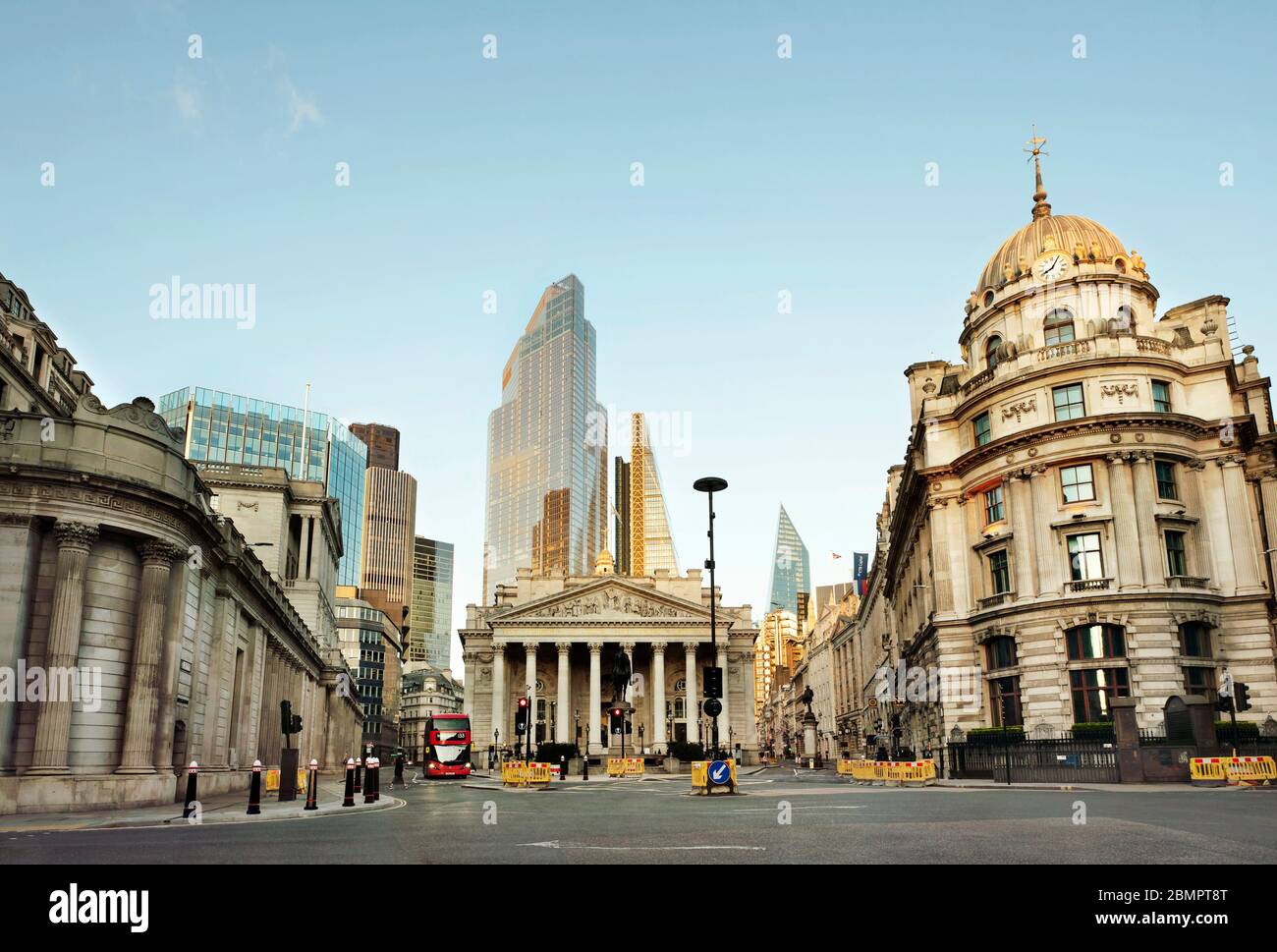 The City of London with the Bank of England (left); The Royal Exchange (centre) and No. 1 Cornhill building. Day 7 of the lockdown, London, Mar 2020 Stock Photo
