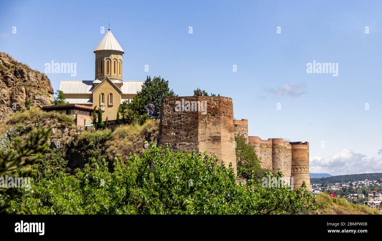 Narikala Fortress and Saint Nicholas Church sits on a hill high above the Tbilisi city center Stock Photo