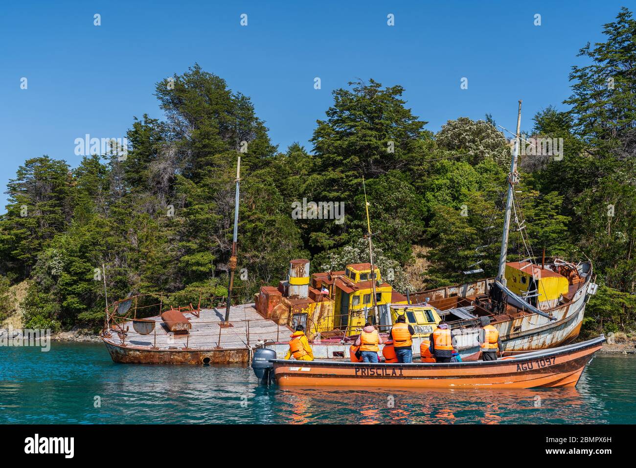 Tourist boat visiting famous shipwreck in the General Carrera Lake near Puerto Rio Tranquilo in Chile, Patagonia, South America. Stock Photo