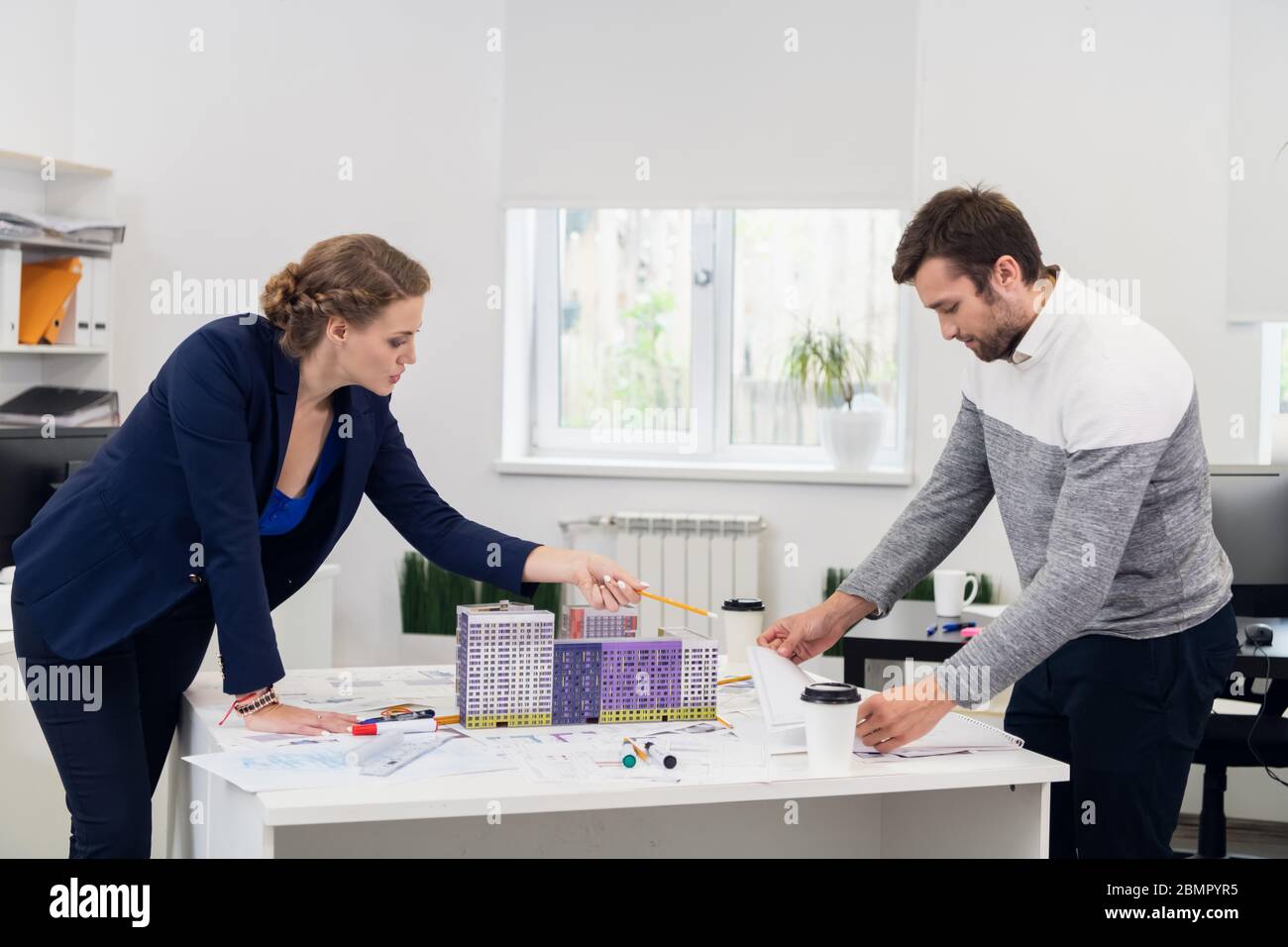 A team of engineers brainstorming ideas about their project Stock Photo ...