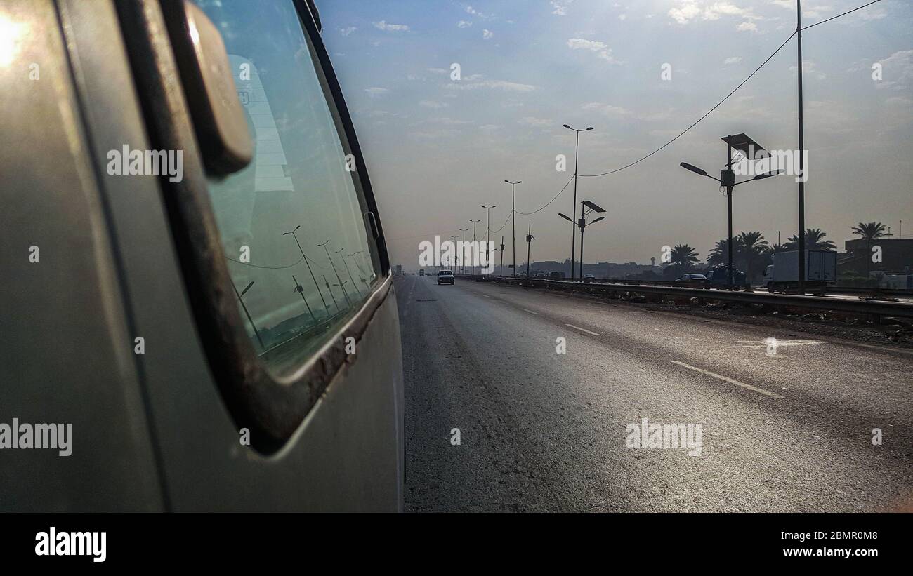 An outside view from the window of a mini bus for the international highway during a road-trip Stock Photo