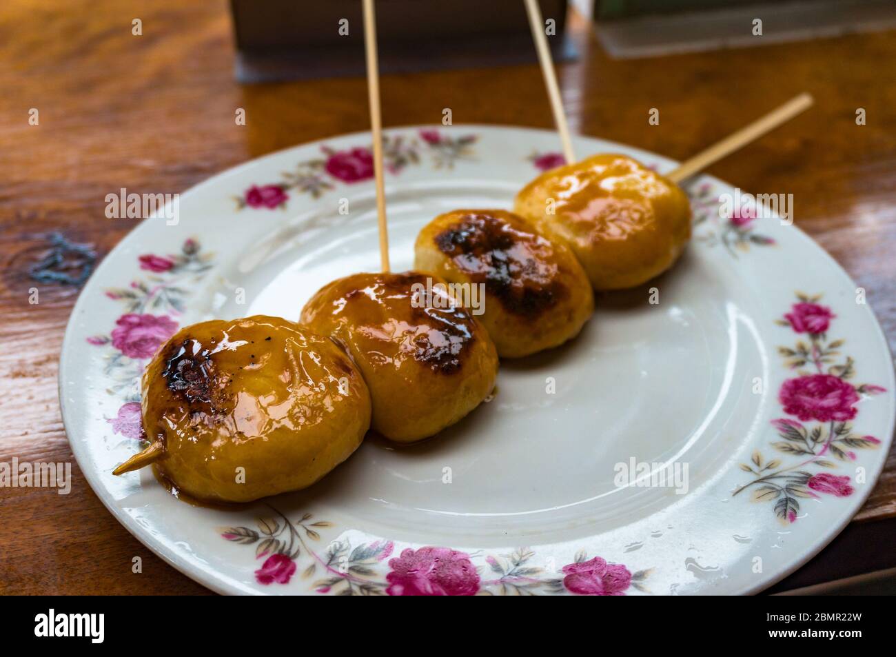 Japanese dango sweet dumplings on rustic plate. Traditional Japanese