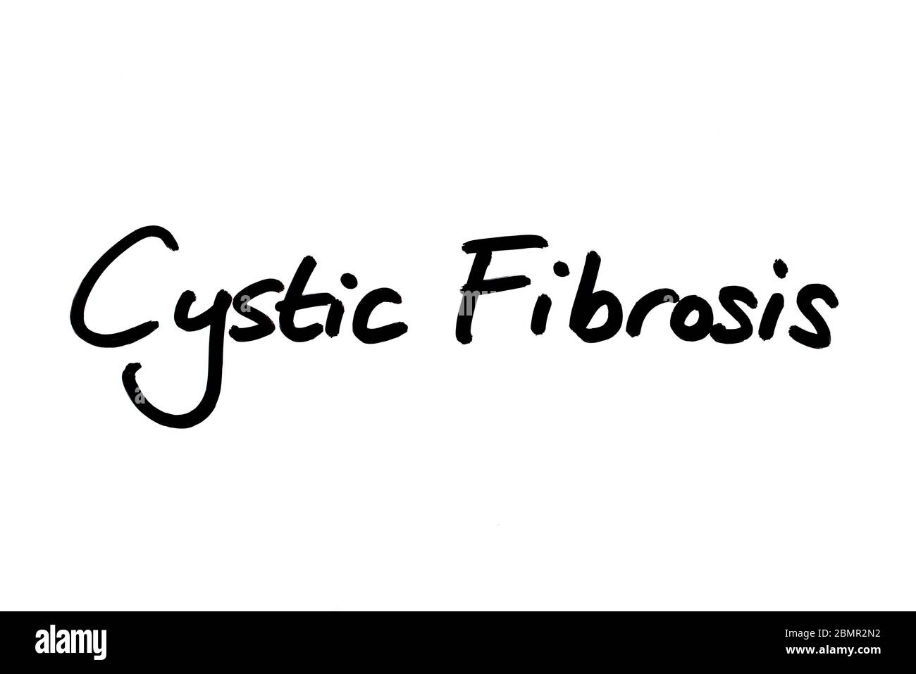 Cystic Fibrosis handwritten on a white background. Stock Photo