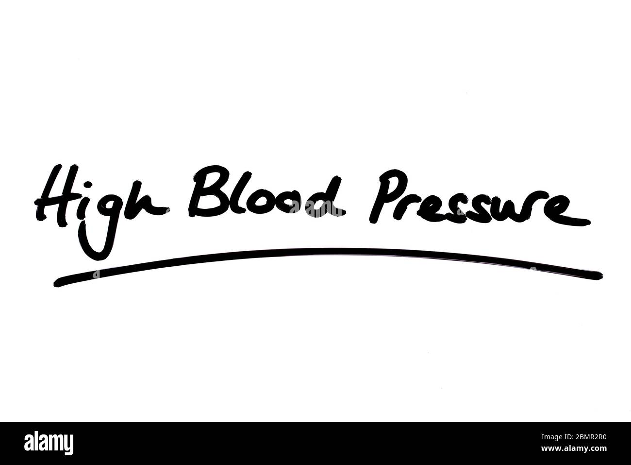 High Blood Pressure handwritten on a white background. Stock Photo