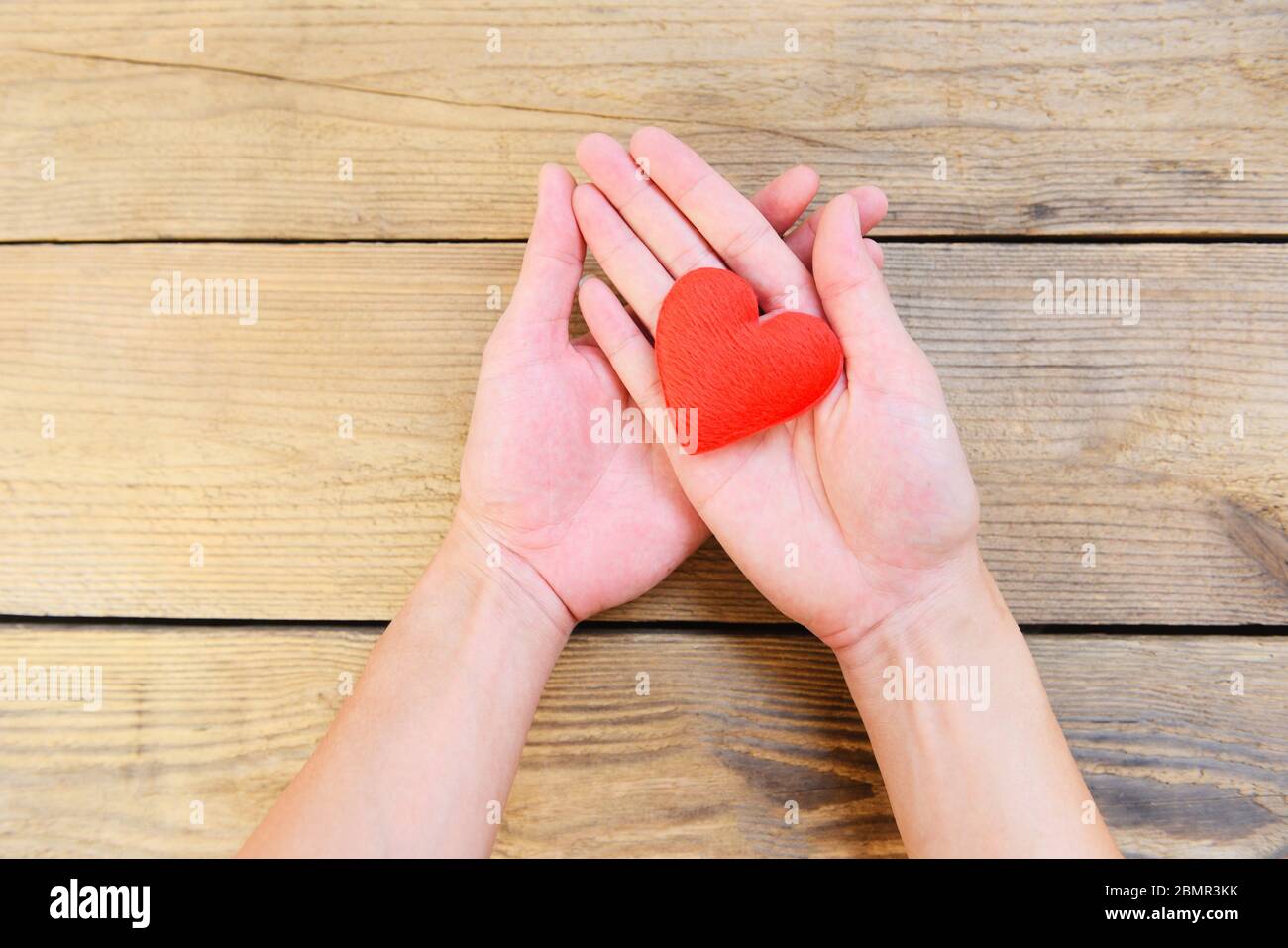 Hands Holding Heart Give Love Philanthropy Donate Help Warmth Take Care Valentines Day Health Care Love Organ Donation Family Insurance World Health Stock Photo Alamy