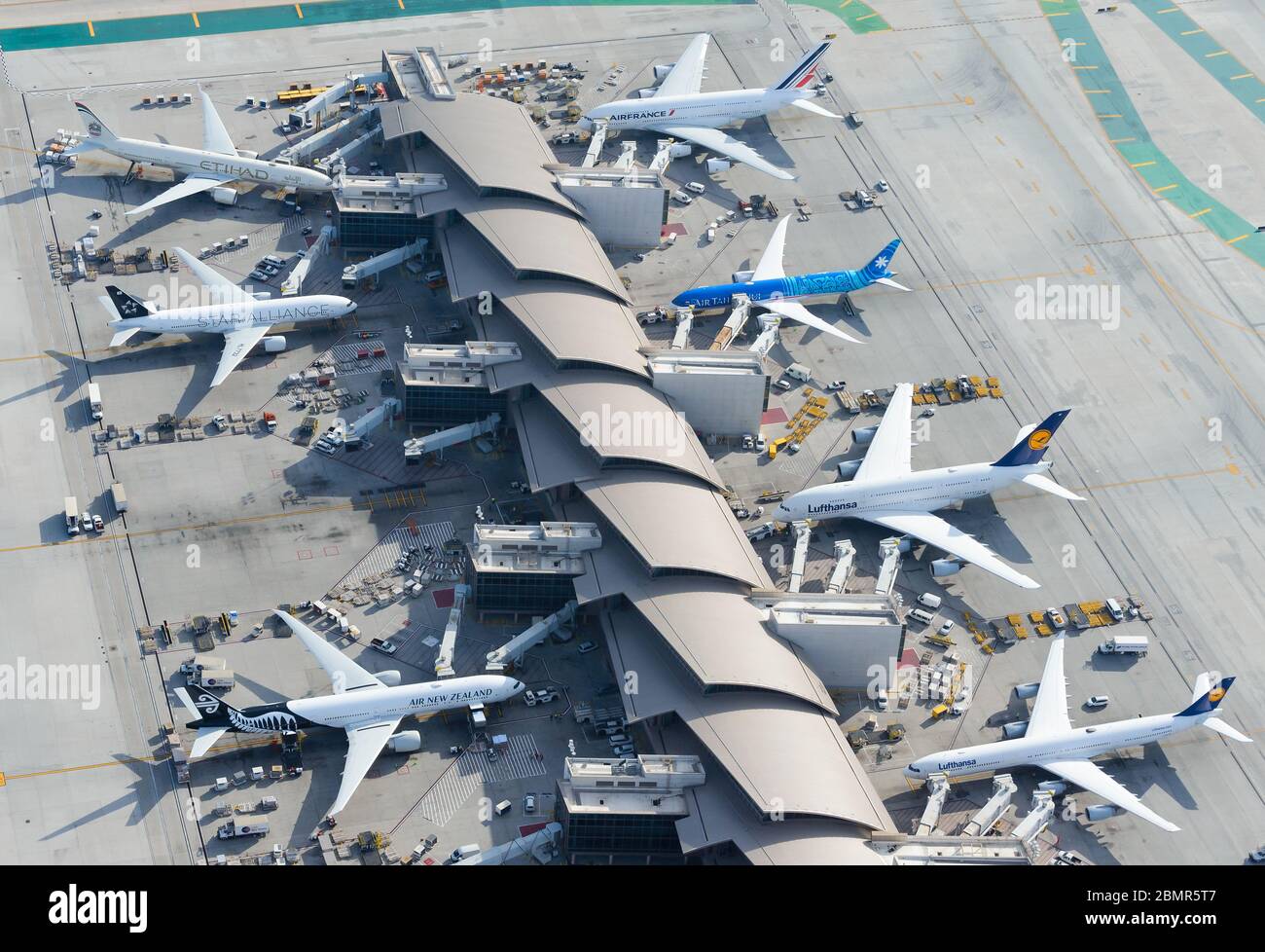 Aerial view of Tom Bradley International Terminal at Los Angeles Airport LAX, USA. Air travel demand in airport concourse seen from above. Stock Photo