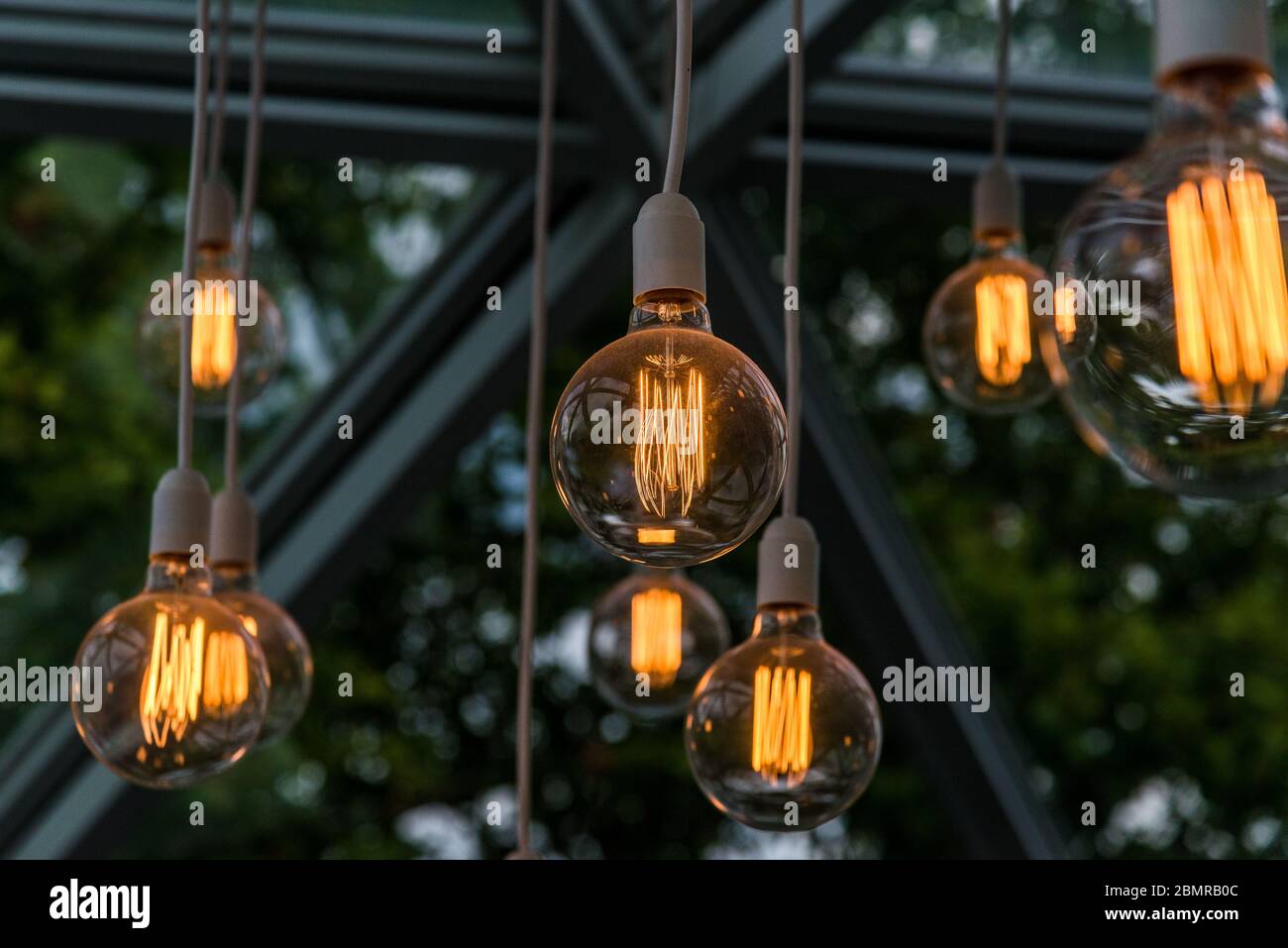Vintage antique hanging light bulbs. Holidays and business good idea concept. Stock Photo
