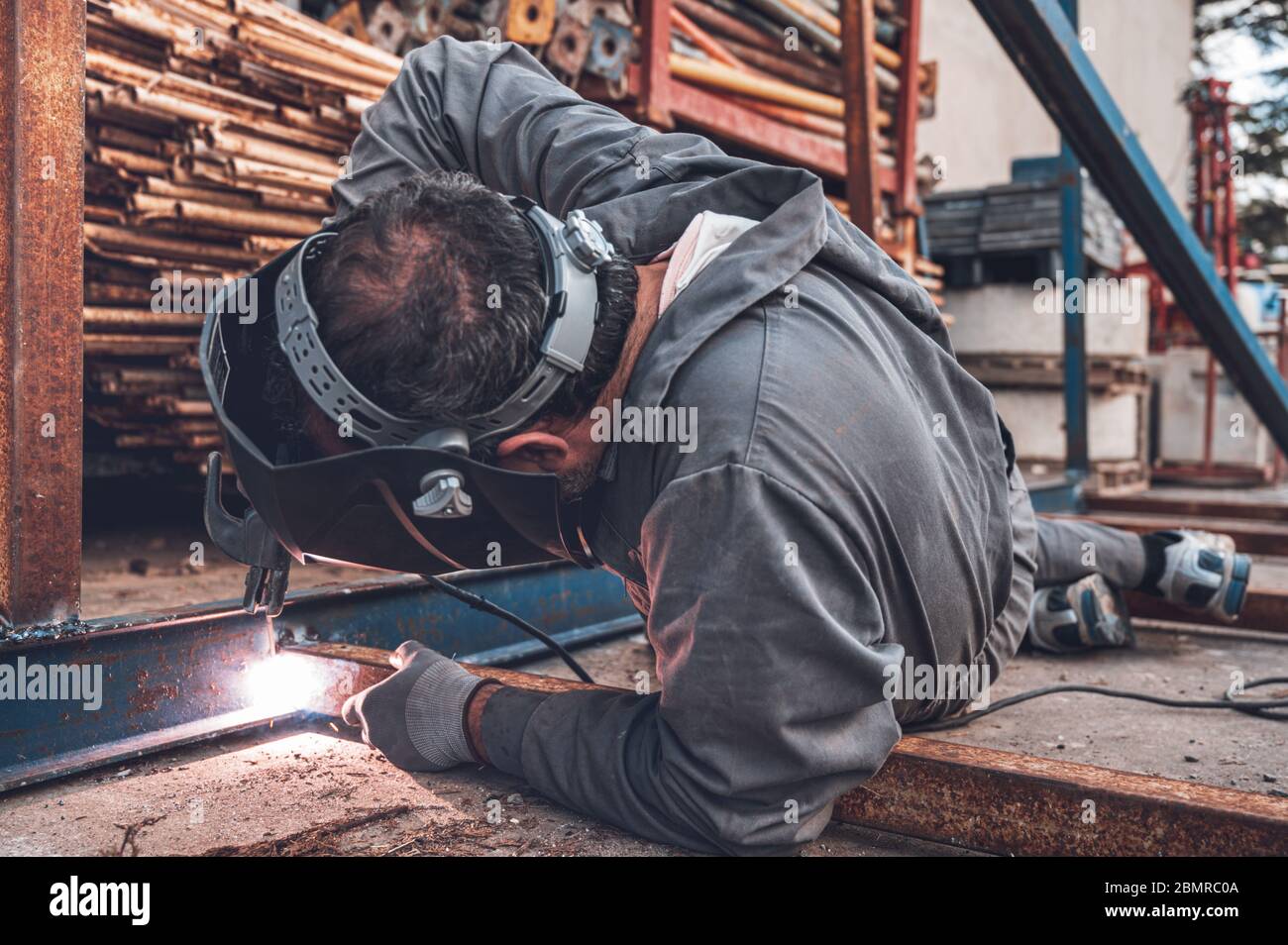 Welding work, Man Welding in Workshop. Metalwork and Sparks. Construction and Industrial concept . Stock Photo
