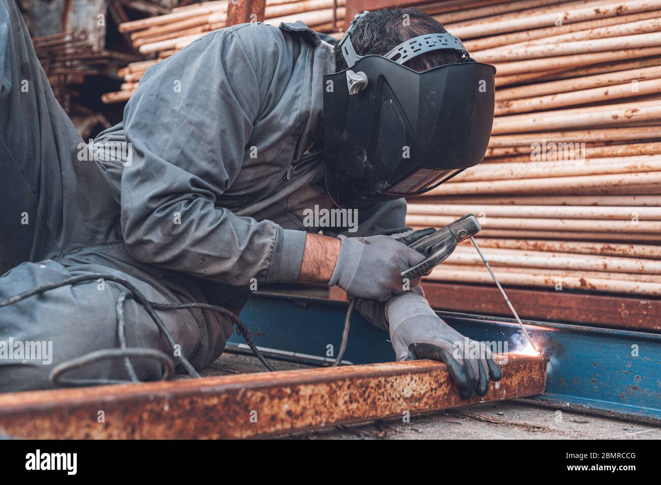 Welding work, Man Welding in Workshop. Metalwork and Sparks. Construction and Industrial concept . Stock Photo