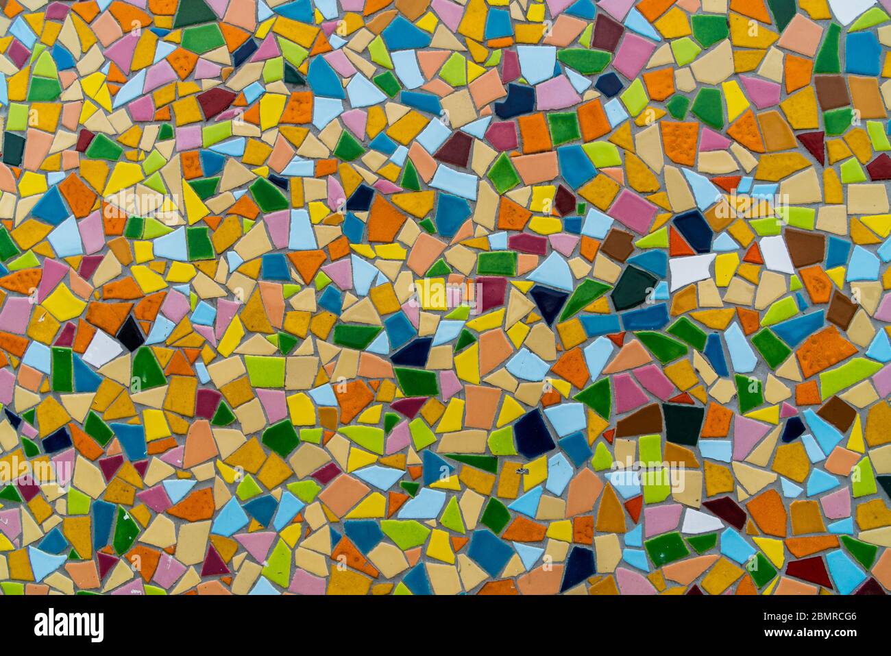 Pattern texture of colorful small mosaic tiles on the wall. Stock Photo