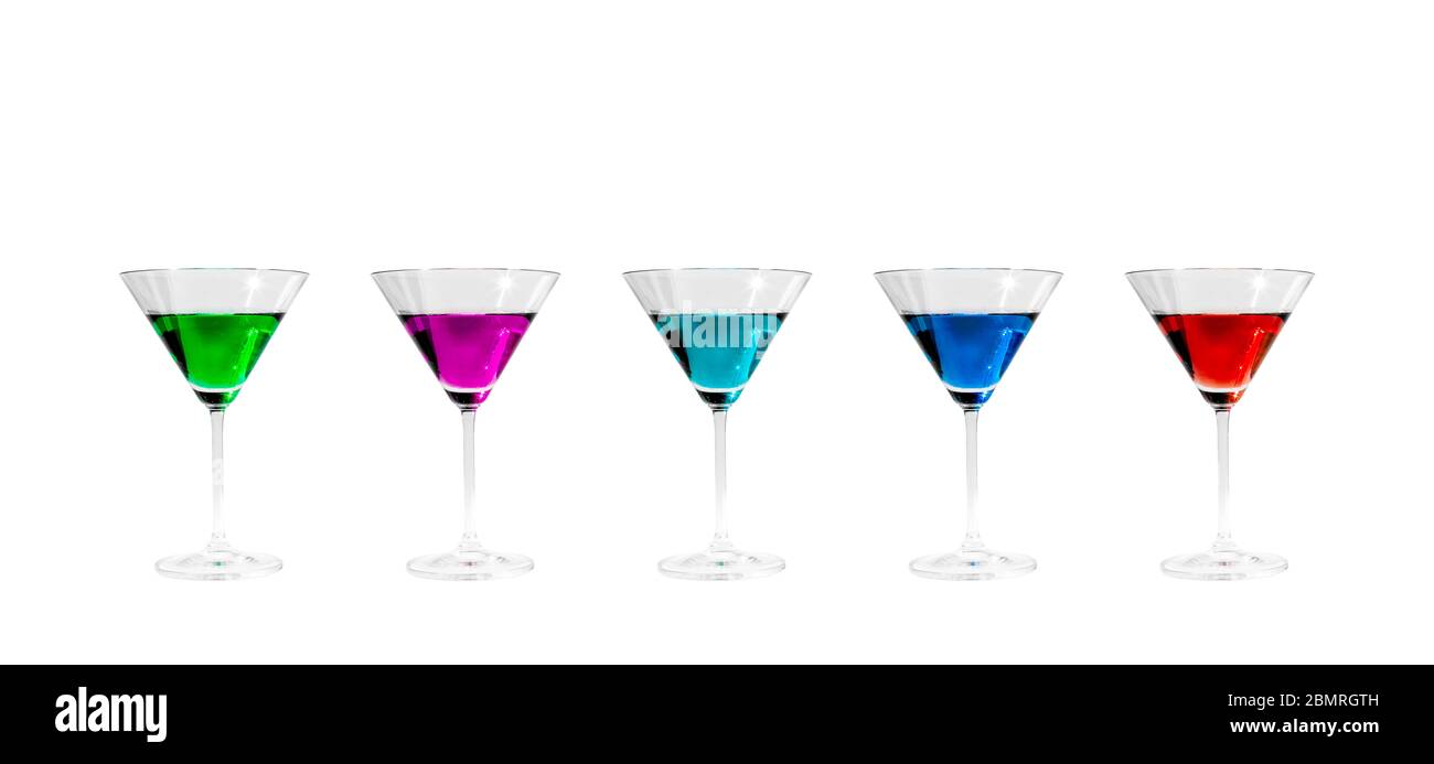 Rainbow row of multiple bright color drinks in crystal clear martini glasses on white background, Virginia, United States, North America, color Stock Photo
