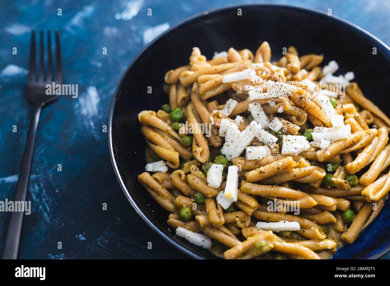 healthy plantbased food recipes concept, chickpea pasta with peas and vegan feta Stock Photo