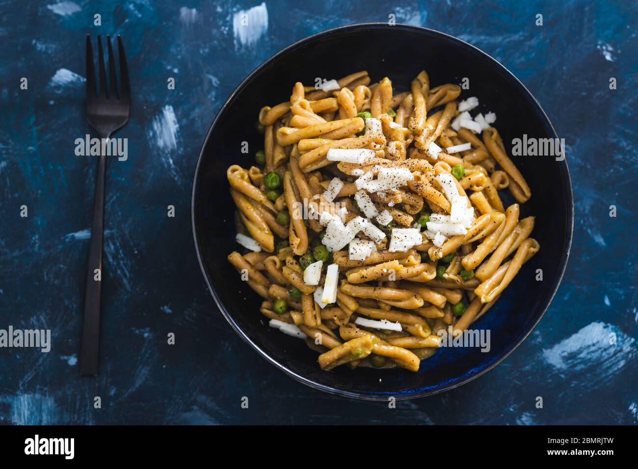 healthy plantbased food recipes concept, chickpea pasta with peas and vegan feta Stock Photo