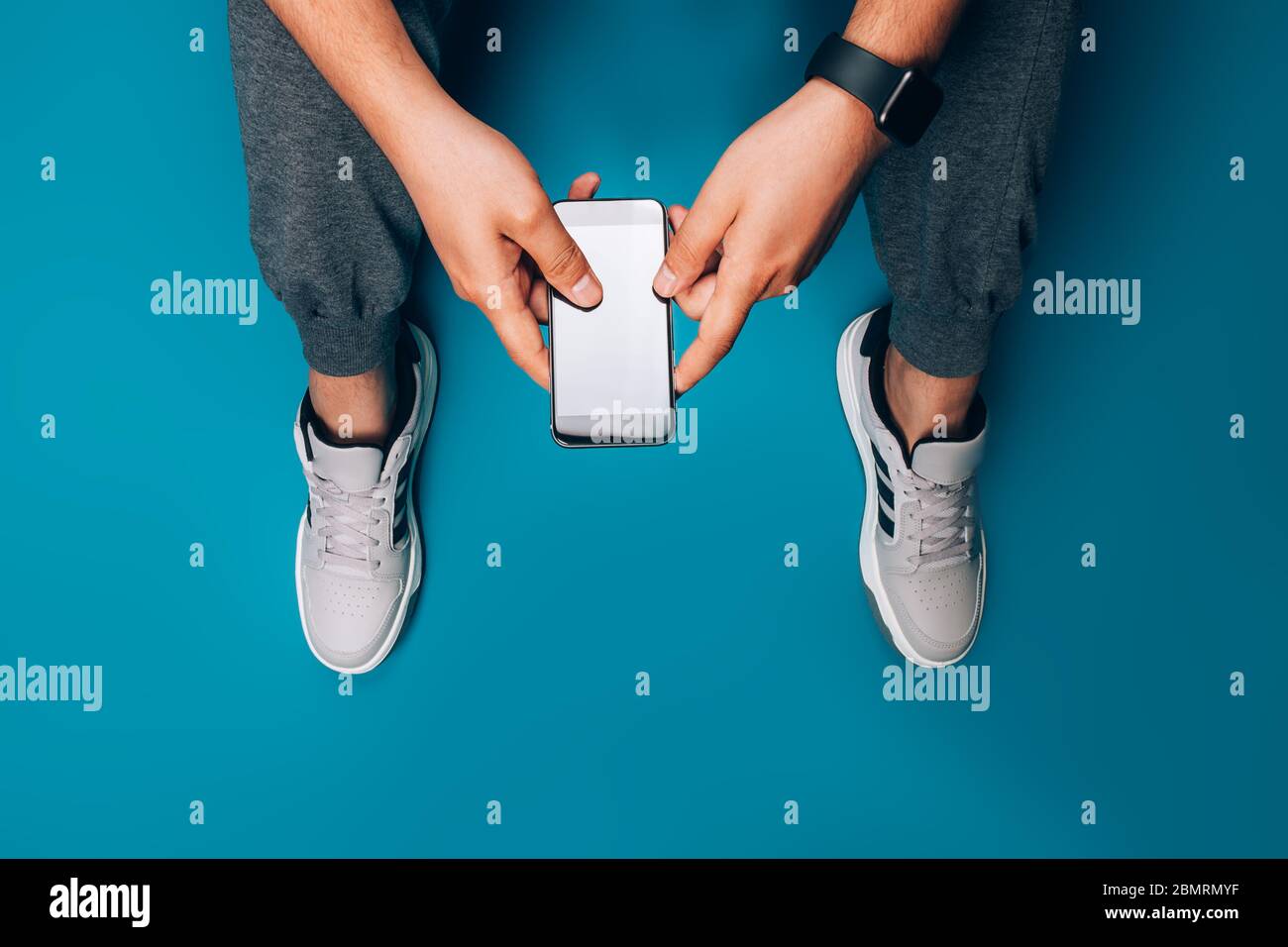Guy holding smart phone Stock Photo